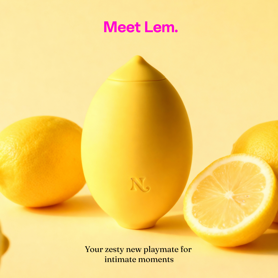 Meet Lem — Nancy's lemon-shaped clitoral massager beside fresh lemons
